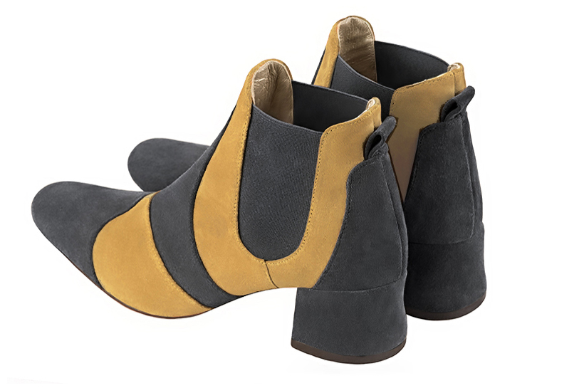 Dark grey and mustard yellow women's ankle boots, with elastics. Round toe. Low flare heels. Rear view - Florence KOOIJMAN